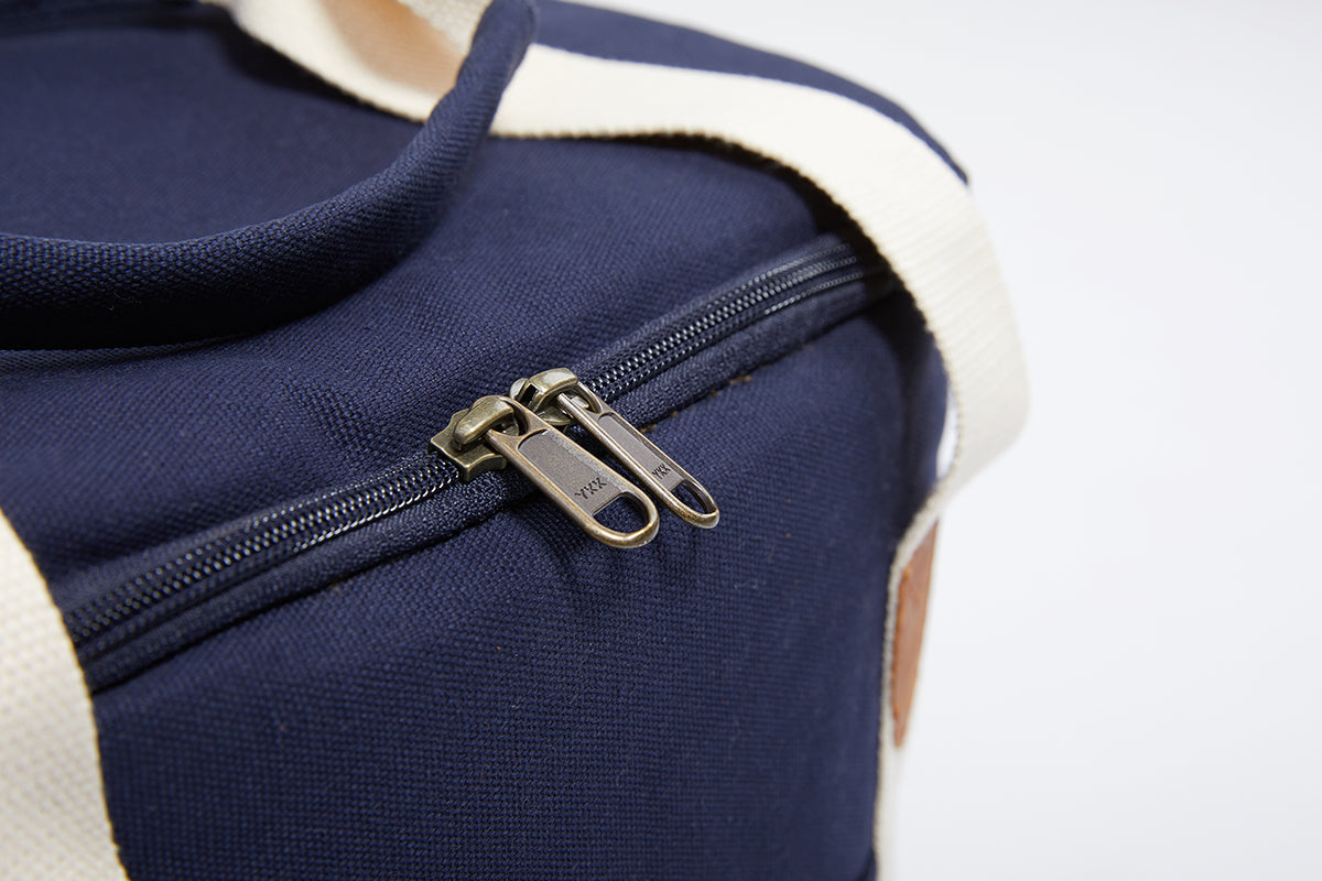 A detailed image of the Navy Cooler Bag YKK zips