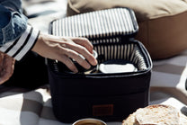  lunchbox with food items on a picnic