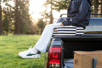 navy-and-white striped cushion