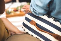 the navy and cream striped Slowlife Collection cushion