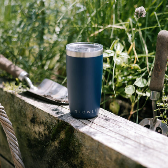 Blue tumbler on a wooden ledge 