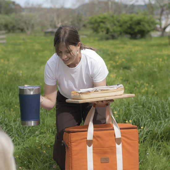a blue insulated cup and a bag 
