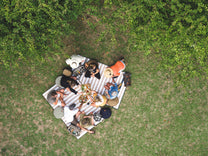  people sitting on the Slowlife Collection Picnic Rugs 