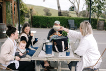 A black and white insulated picnic bag