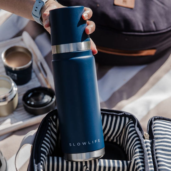 Blue thermos with 'Slowlife' branding