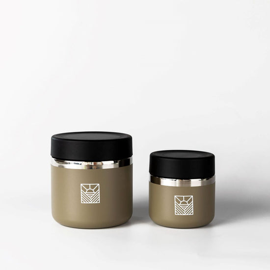 Two metallic containers with black lids