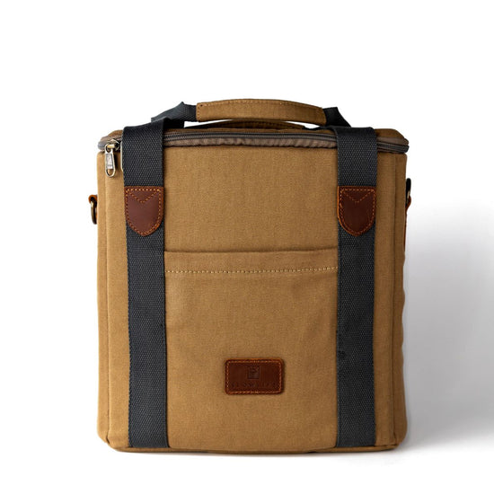 Brown leather bag with black straps