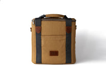 Brown leather bag with black straps