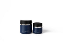 Two navy blue containers with black lids 