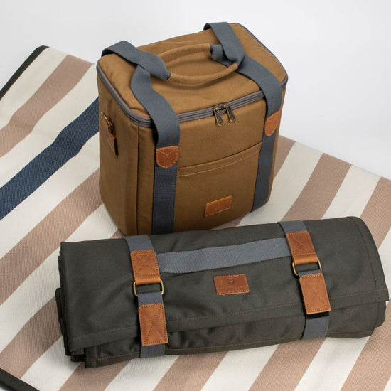 Brown and gray bag on a striped fabric