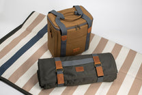 Brown and gray bag on a striped fabric