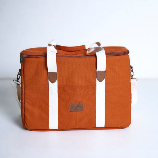 Terracotta Picnic bag with white straps on a white background