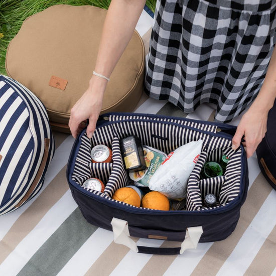 packing a picnic basket with food items