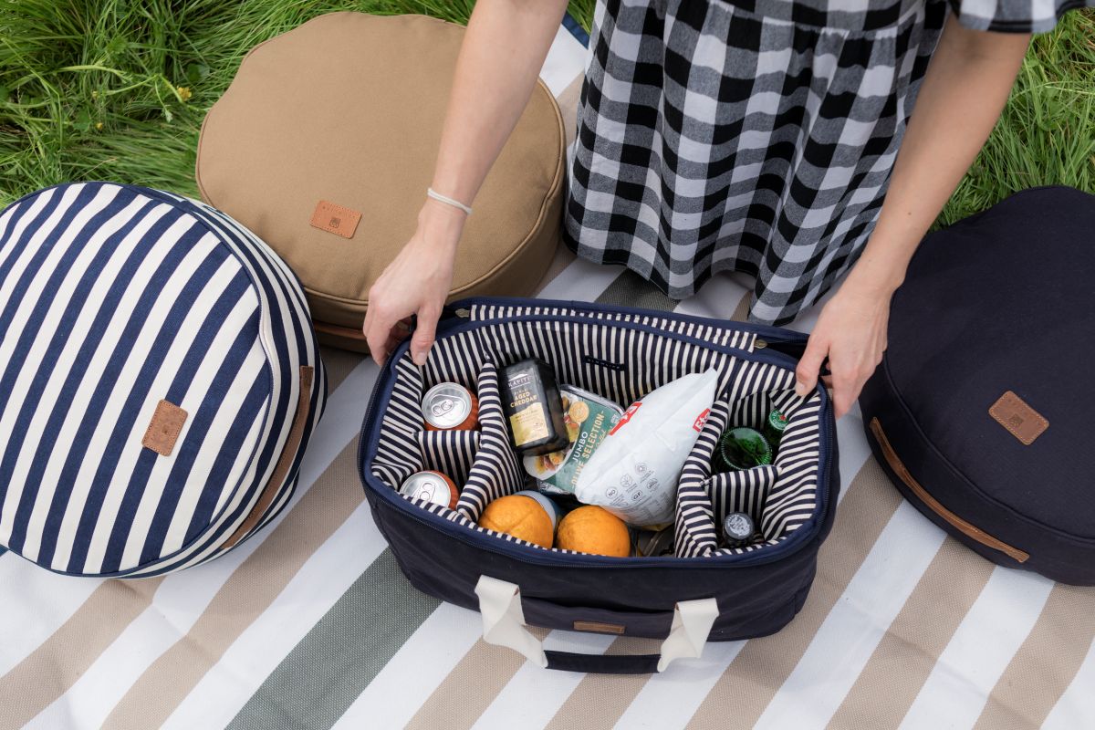 packing a picnic basket with food items