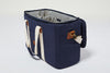 The Navy Slowlife Collection Picnic Bag side on with the top zipped open to show the navy and cream interior.